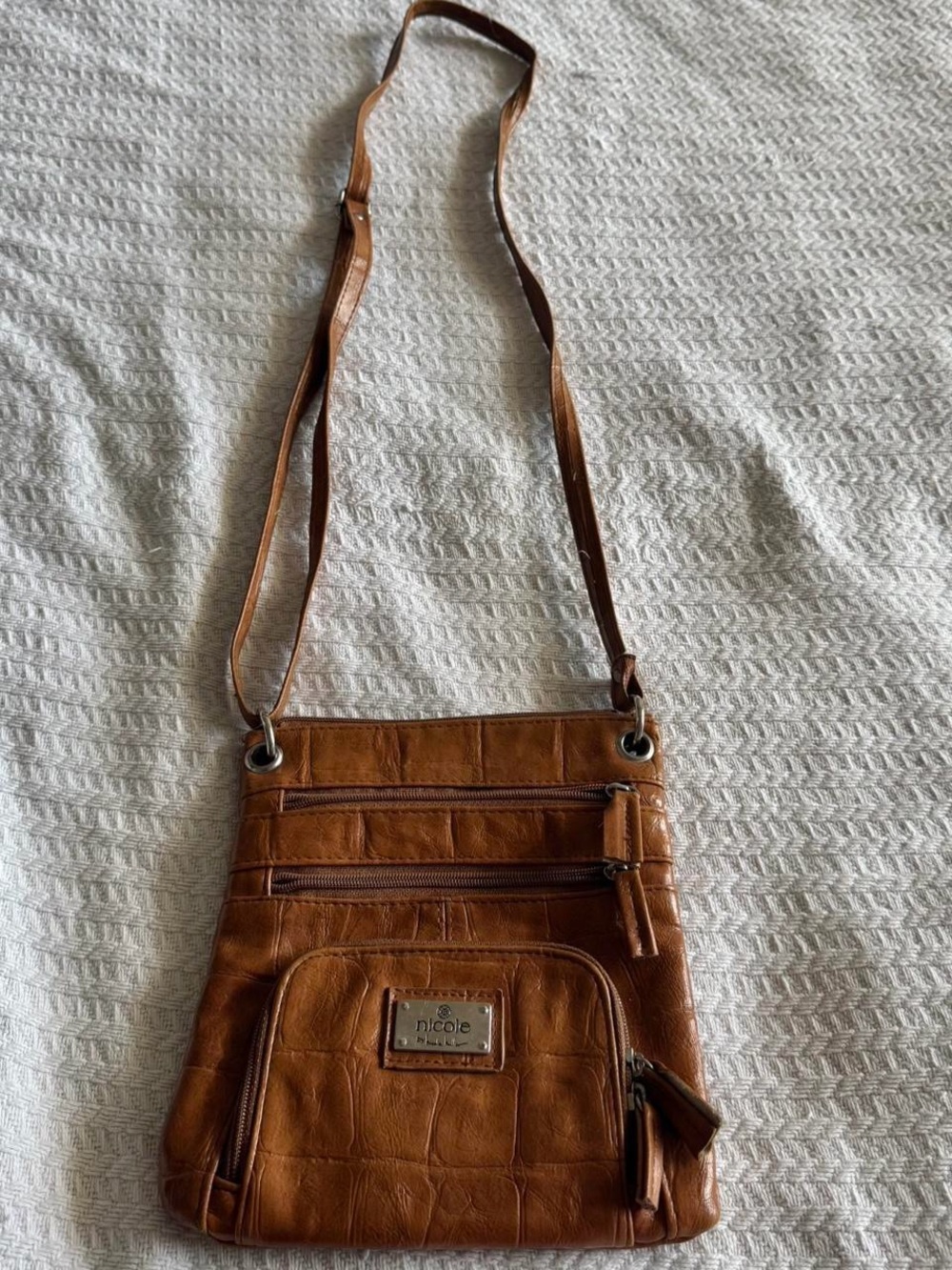 Nicole Miller Brown “leather” bag with zipper closure